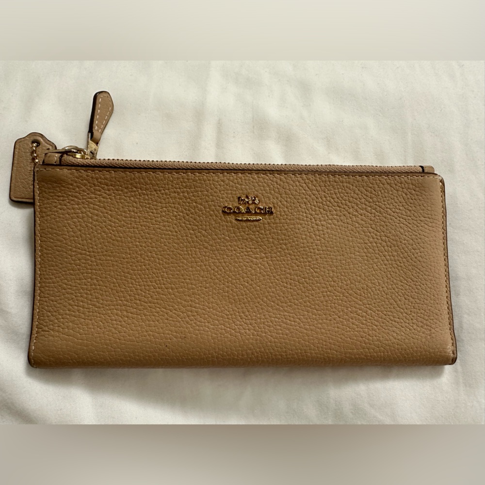 Coach double zipper wallet. Slick deigns with two zip pockets. NWOT